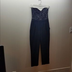 Black jumpsuit cut lace on the top with tight leg